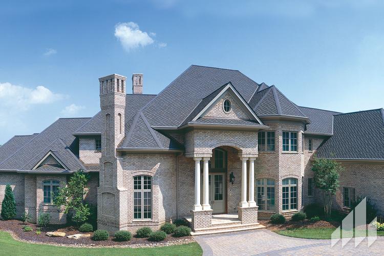 Large brick house with high roofs